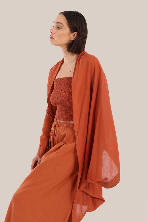 Embroidered cover up coat with short sleeves.